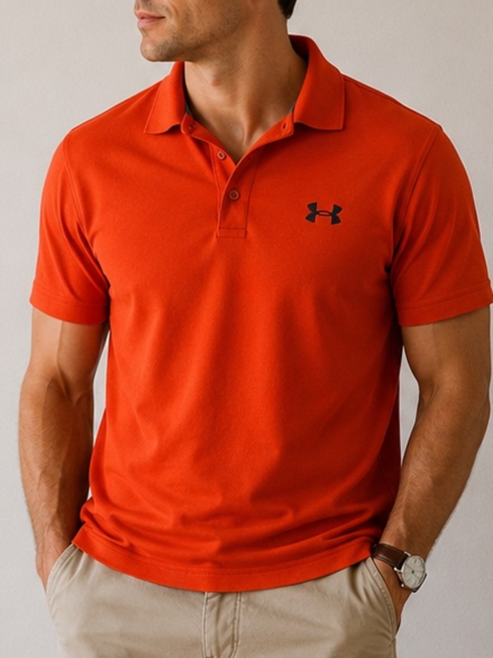Under Armour Men’s Orange Polo with Black Logo